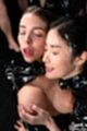On her knees eyes closed girlfriend cupping her breasts cum on her face